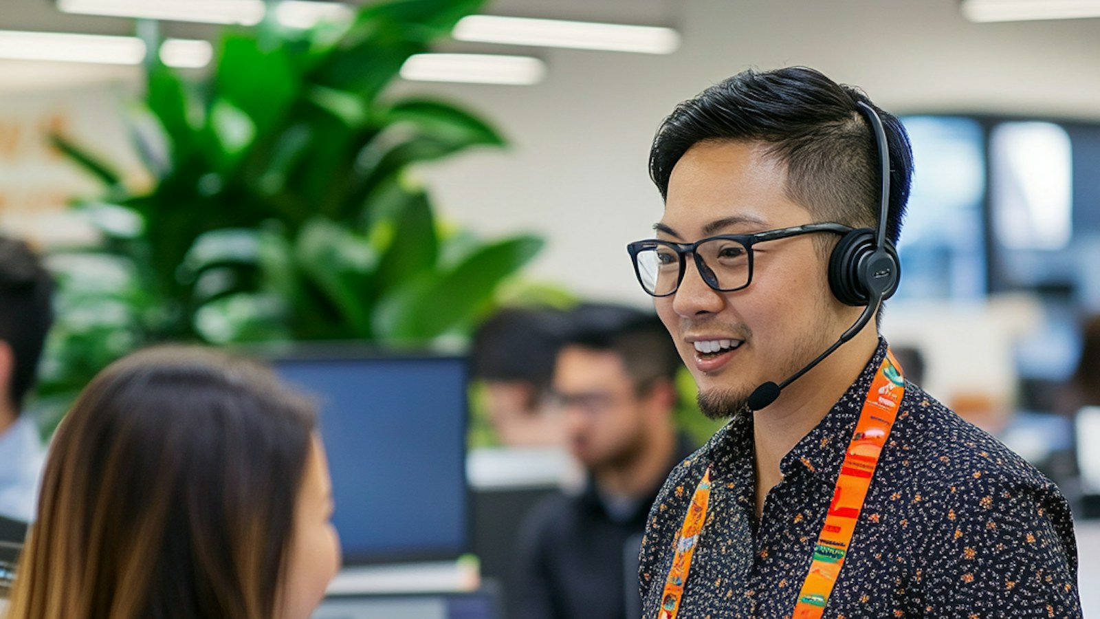Customer support agent helping a customer in an office